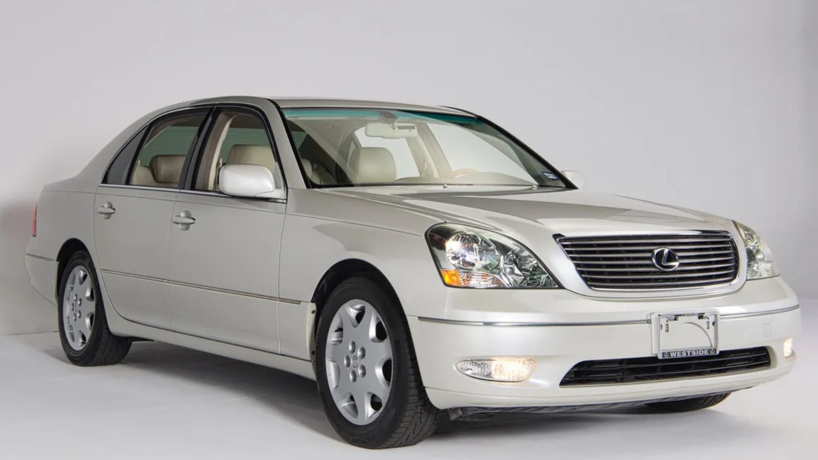 A white 2001 Lexus LS430 sedan parked in right front angle view