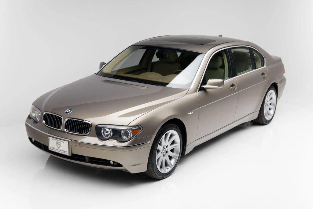 A champagne 2002 BMW 745Li parked in aerial left front angle view