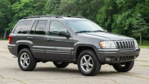 A grey 2002 Jeep Grand Cherokee Overland V8 HO parked in right front angle view