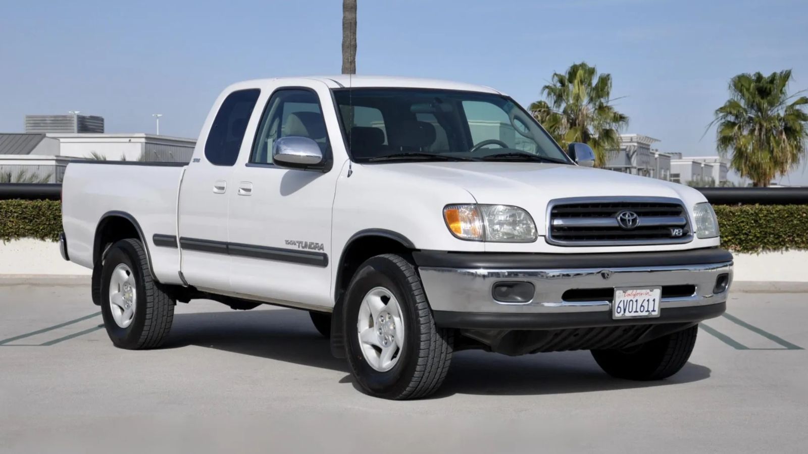 A white 2002 Toyota Tundra SR5 V8 parked in right front angle view