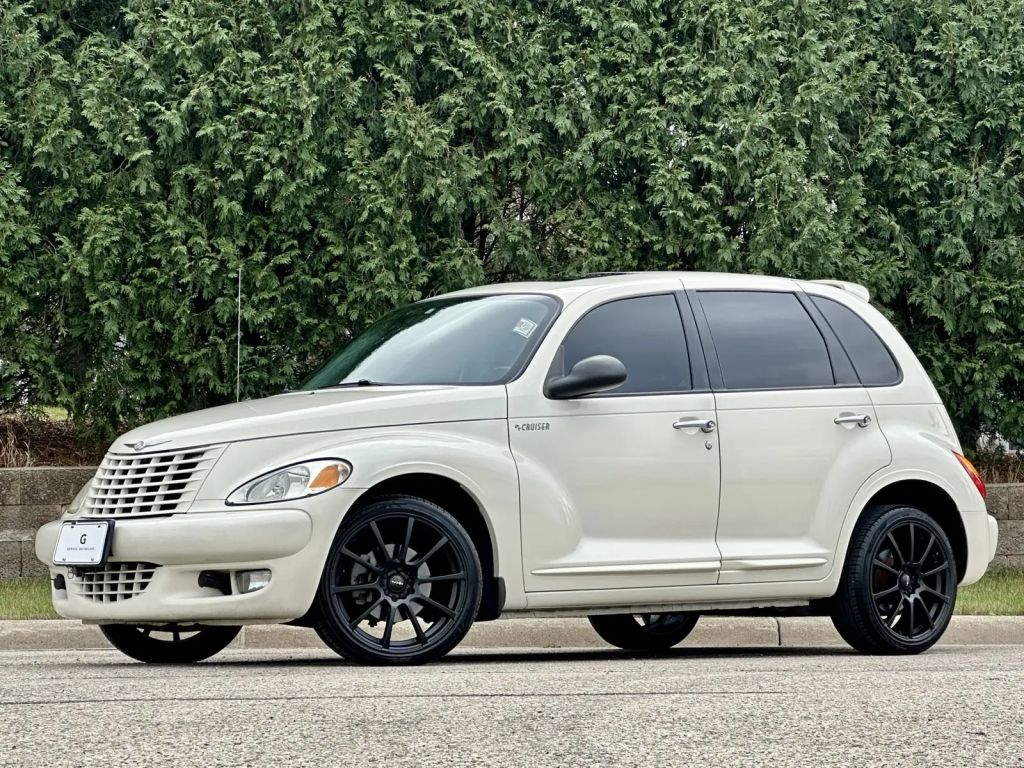 A white 2004 Chrysler PT Cruiser parked in left profile view