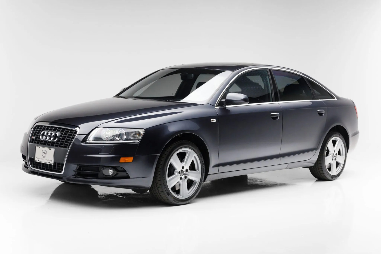 A dark metallic 2008 Audi A6 sedan equipped with the 4.2L engine