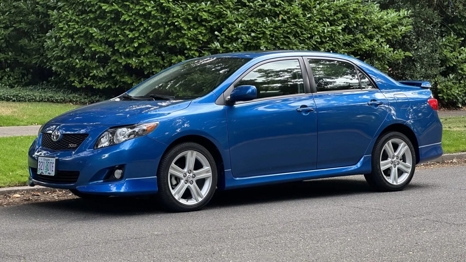 A blue 2009 Toyota Corolla parked in left front angle view