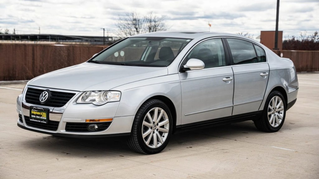 A silver 2010 VW Passat sedan parked in left front angle view