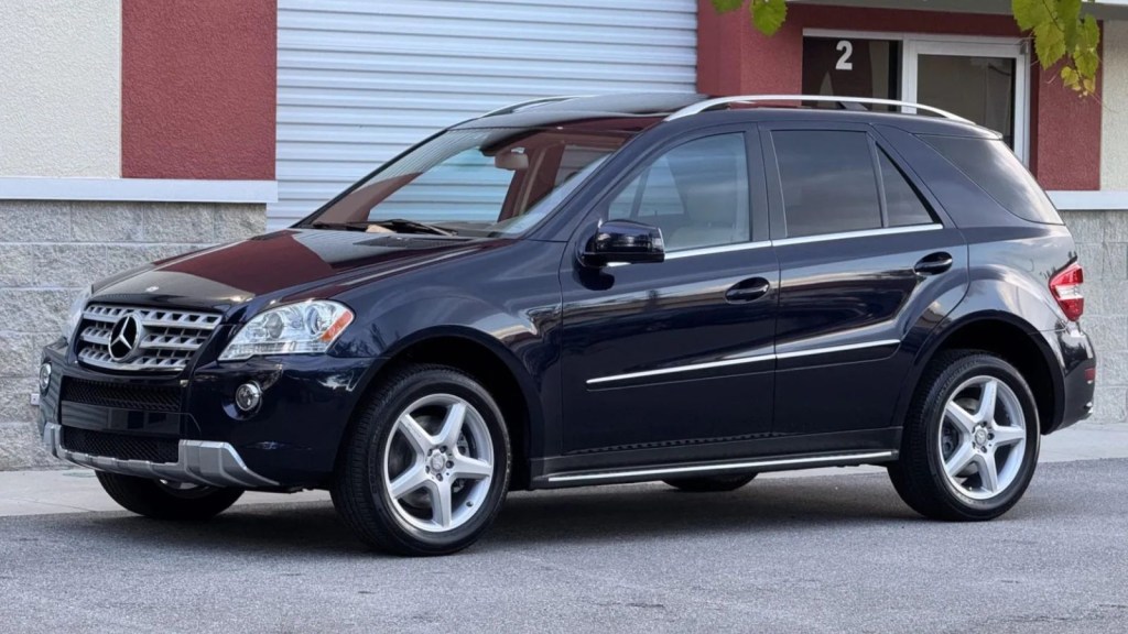 A black 2011 Mercedes-Benz ML550 4MATIC parked in left angle profile view