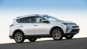 A white 2017 Toyota RAV4 parked in right profile view