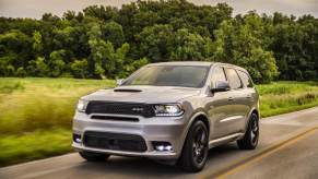 A grey 2020 Dodge Durango SRT driving in left front angle view