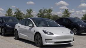 A white 2021 Tesla Model Y EV parked in right front angle view
