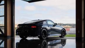 A Nissan Z NISMO reflects on a mirrored surface. For 2026, the Z NISMO will get a manual transmission option.