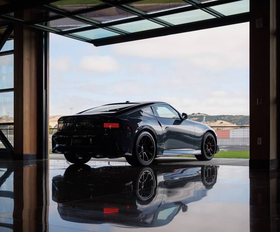 A Nissan Z NISMO reflects on a mirrored surface. For 2026, the Z NISMO will get a manual transmission option.
