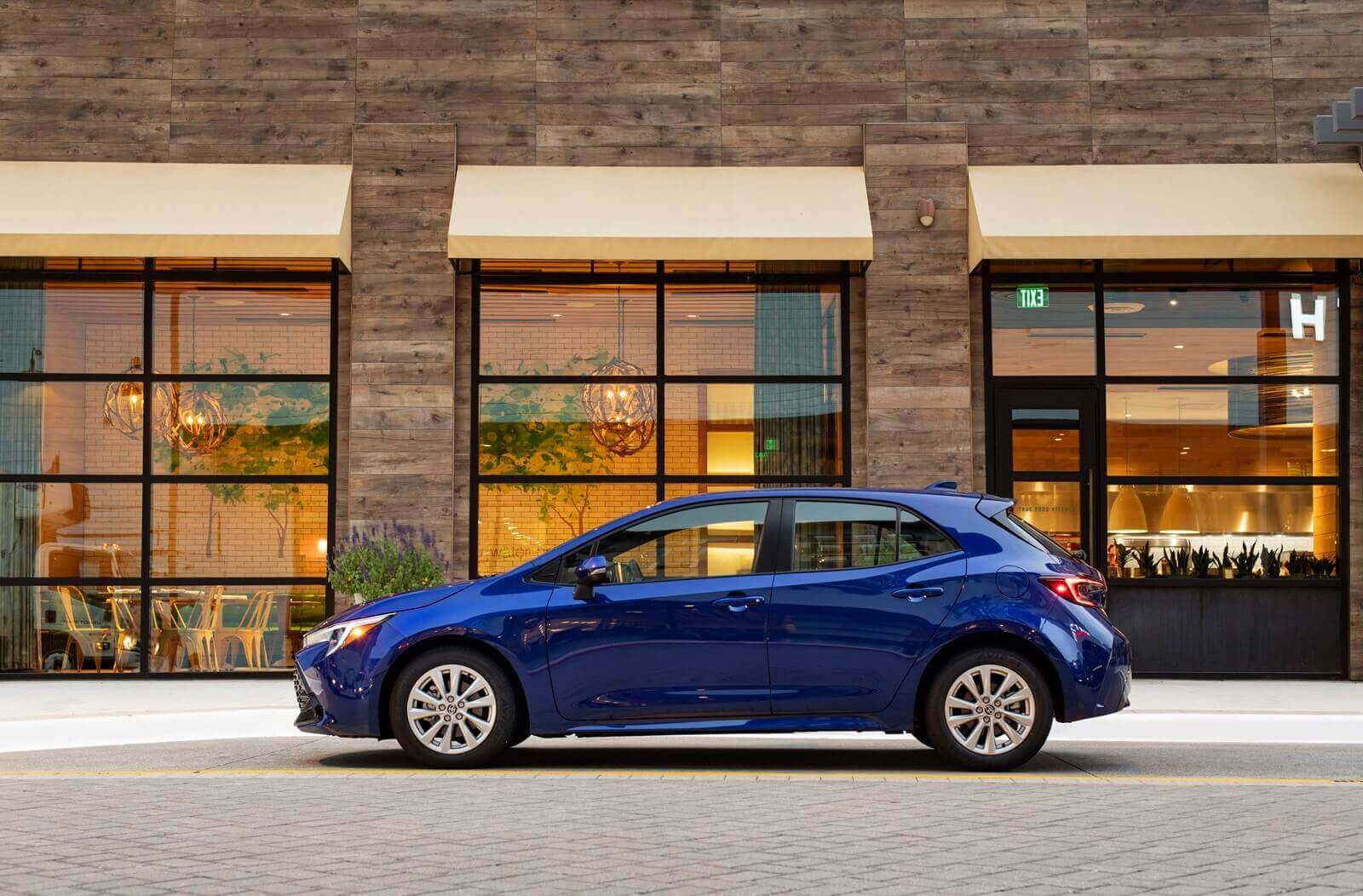 A 2025 Toyota Corolla Hatchback, the No. 10 best car for depreciation-resistance, from the side. 