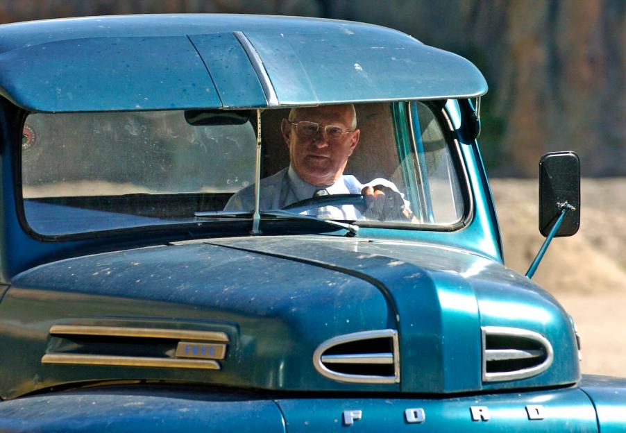 Loyal driver steering a classic Ford truck