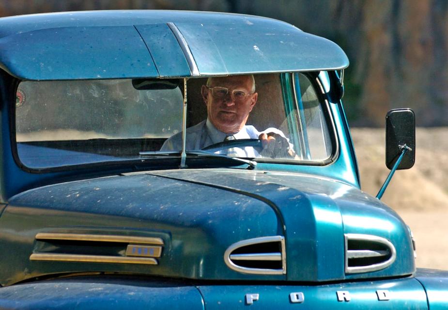 Loyal driver steering a classic Ford truck