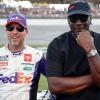 #11 driver Denny Hamlin and 23XI racing co-owner Michael Jordan pose at Talladega during NASCAR lawsuit