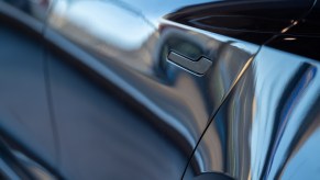 The flush, powered door handle on a Tesla EV