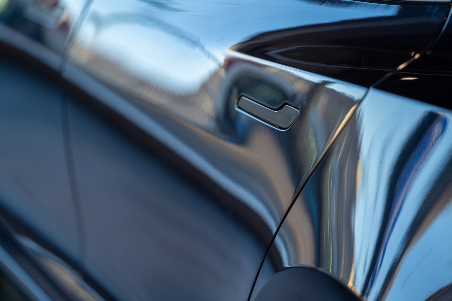 The flush, powered door handle on a Tesla EV