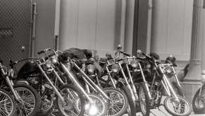 Row of custom motorcycles belonging to a biker club.