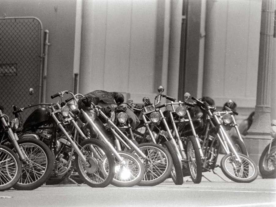 Row of custom motorcycles belonging to a biker club.