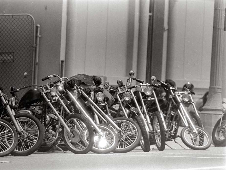 Row of custom motorcycles belonging to a biker club.