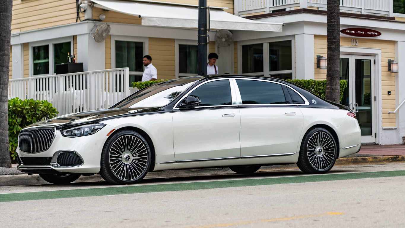 A black and white Mercedes-Benz Maybach S 680 parallel parked in left side view
