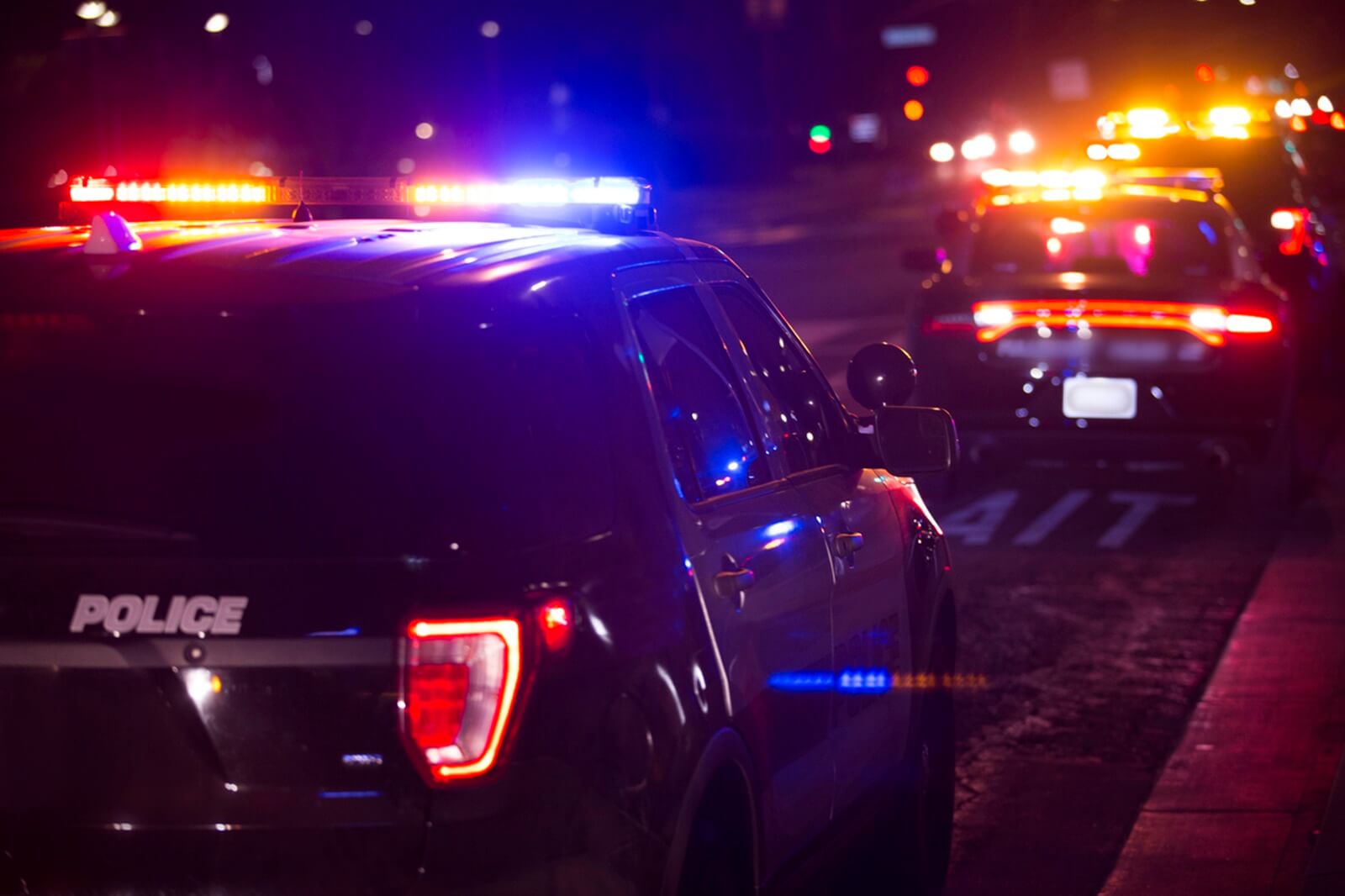 A crime scene where police pulled over a dangerous driver, like a Florida super speeder hitting 103 mph with kids in the car.