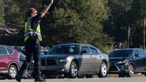 Ohio police officer signals self-driving stolen and abandoned car to stop.
