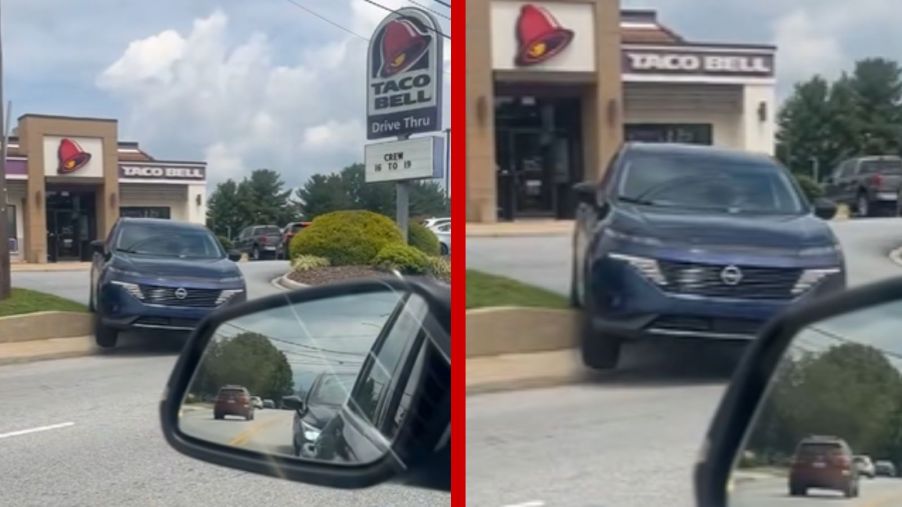 A TikToker records a Nissan SUV hitting a curb in the Taco Bell drive thru