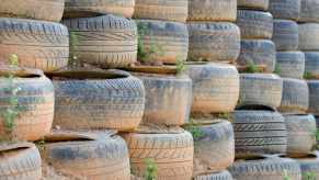 Huge stack of dirty, muddy tires forming part of the "black fortress" in Florida
