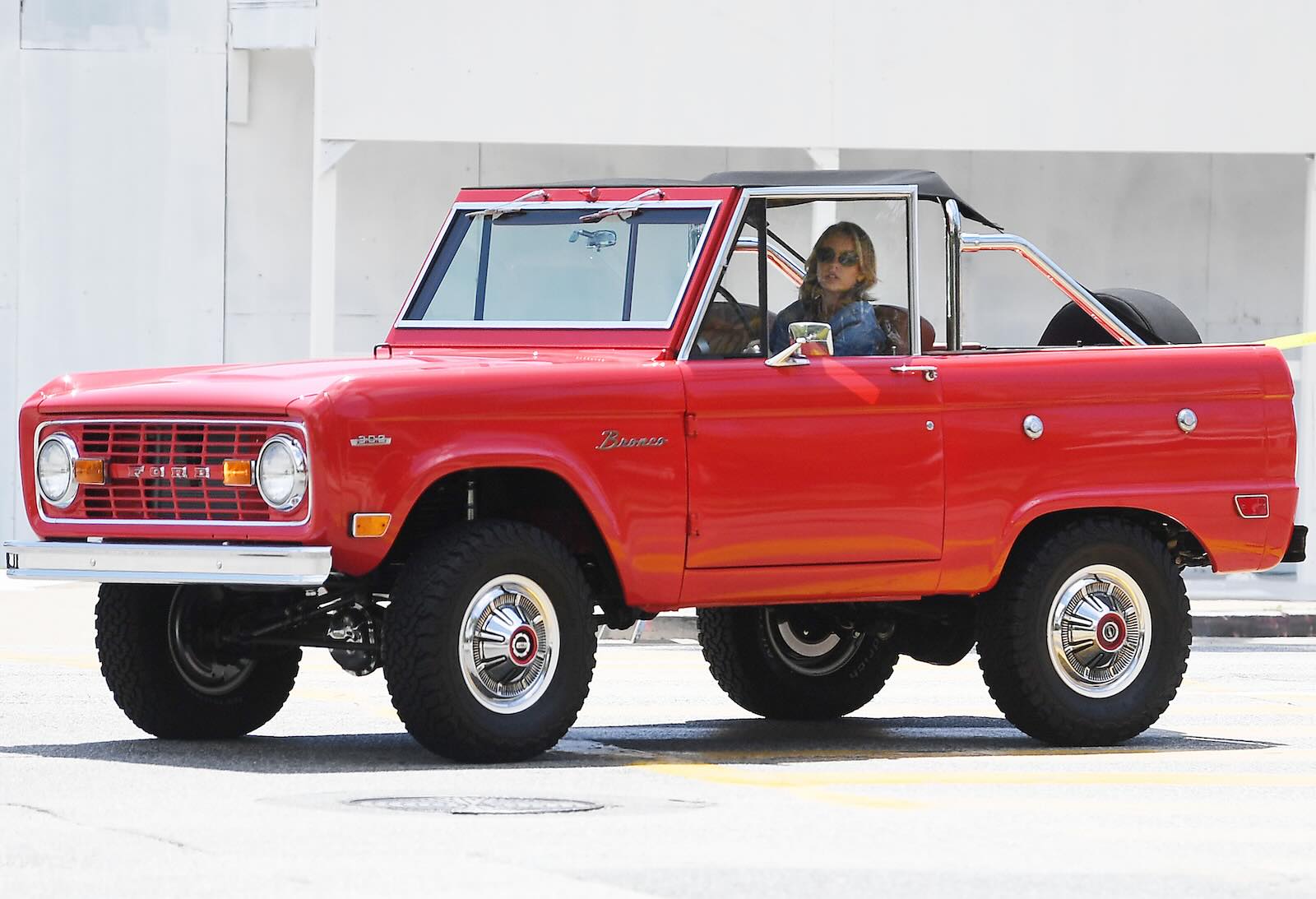Actress Sydney Sweeney drivers her red 1969 Ford Bronco in Beverly Hills.
