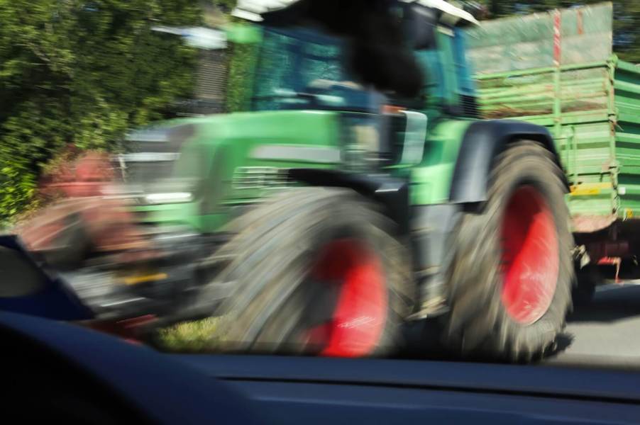 An action shot shows a car about to crash into a tractor like a recent case involving a Minnesota man.