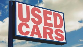 Sign for a lot selling ultra high mileage used cars