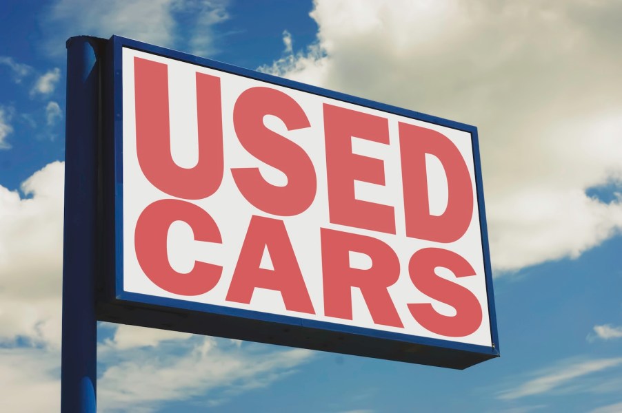 Sign for a lot selling ultra high mileage used cars
