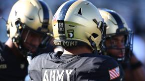 Three Army Black Knights football players shown from shoulders up