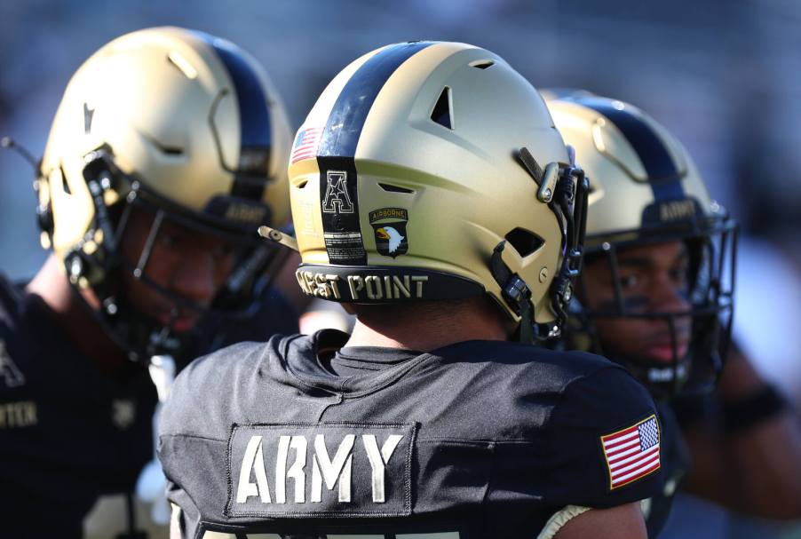 Three Army Black Knights football players shown from shoulders up