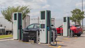 An EV charging station with electric cars plugged in