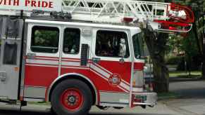 A fire department ladder truck in close view of right cab