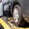 A car on the back of a tow truck