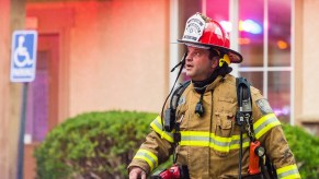 A firefighter responding to an emergency