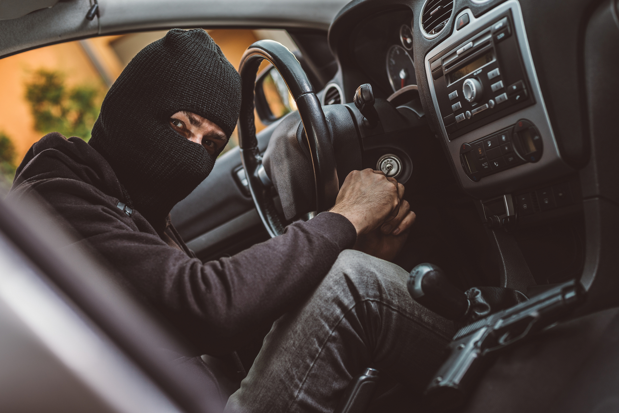 A man stealing a car
