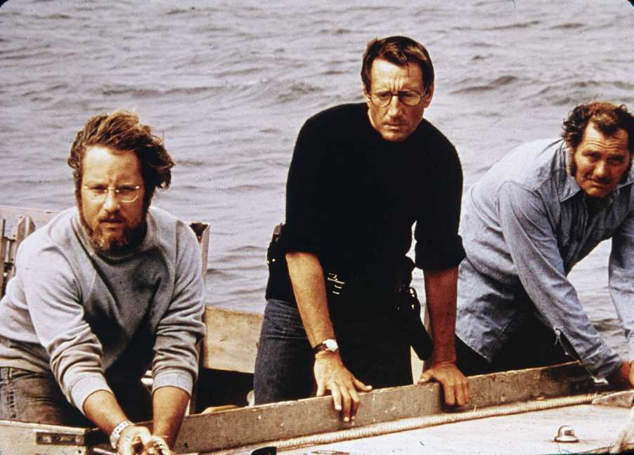 Richard Dreyfuss, Roy Scheider and Robert Shaw on board a boat in a still from the film, 'Jaws,' directed by Steven Spielberg, 1975