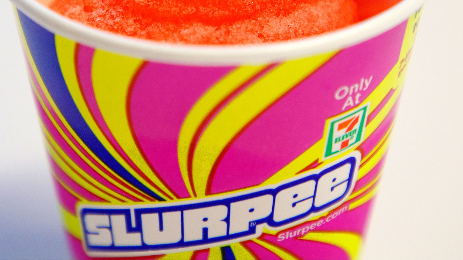 A 7-Eleven branded Slurpee cup in very close view