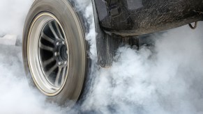 A car tire in close view during a burnout