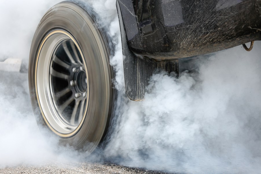 A car tire in close view during a burnout