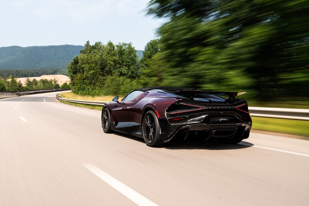 A Bugatti W16 Mistral blasting down a road.