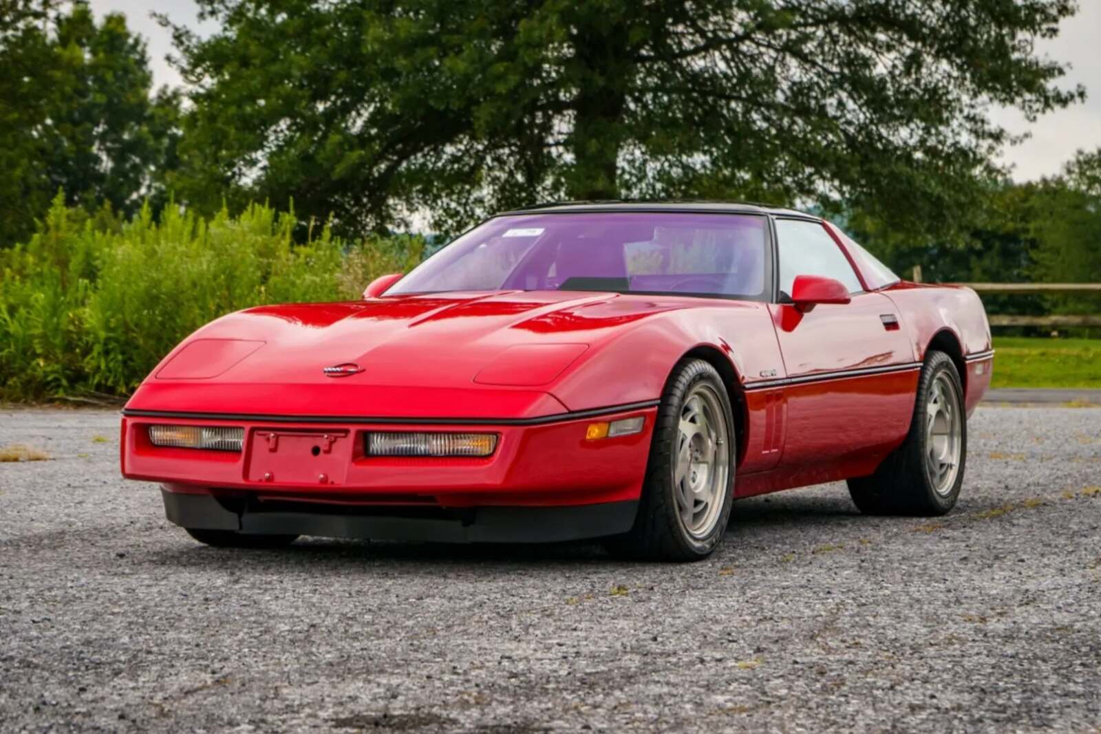 A red 1990 Chevrolet Corvette ZR-1 parked in left front angle view