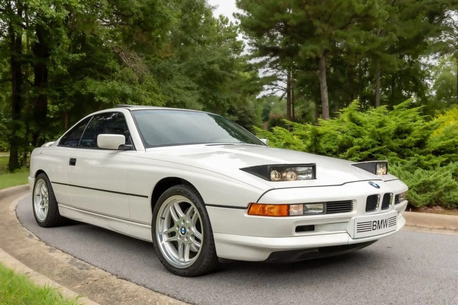 A white 1992 BMW 850i in low right front angle view