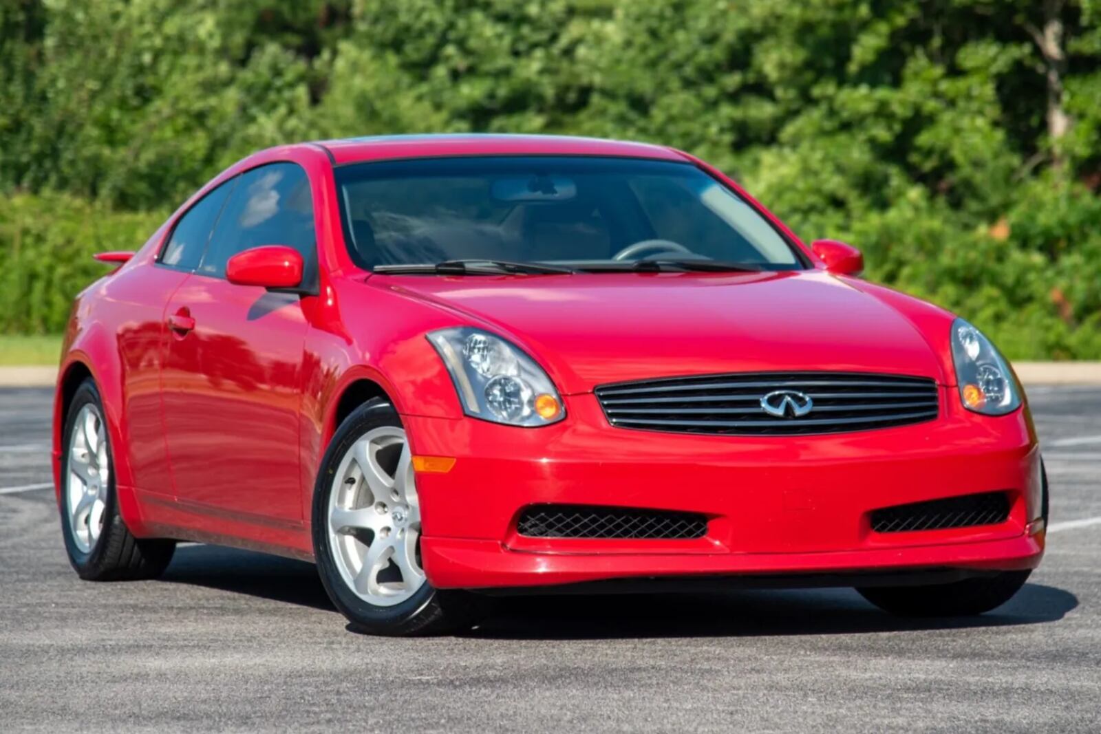 A red 2003 Infiniti G35 Coupe parked in right front angle view
