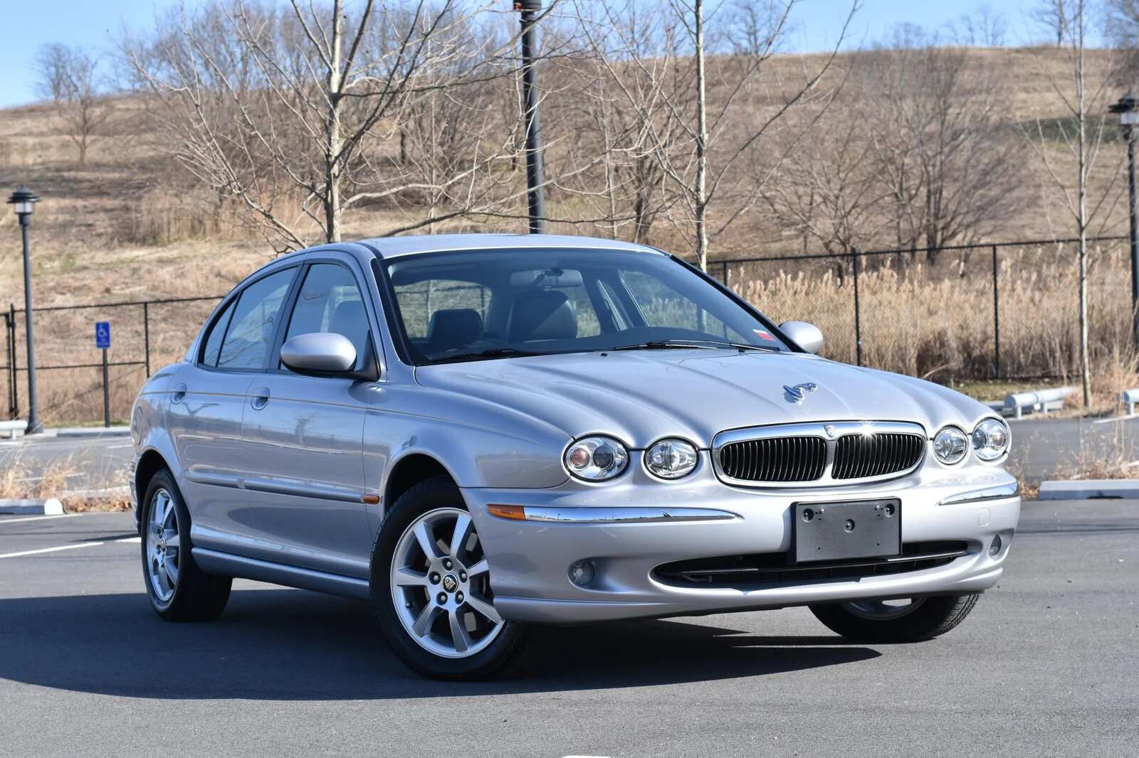A silver 2004 Jaguar X-Type parked in right front angle view