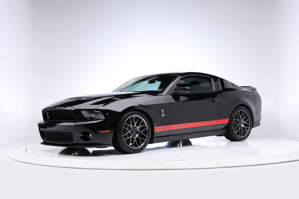 A 2012 Shelby GT500 in black and red.