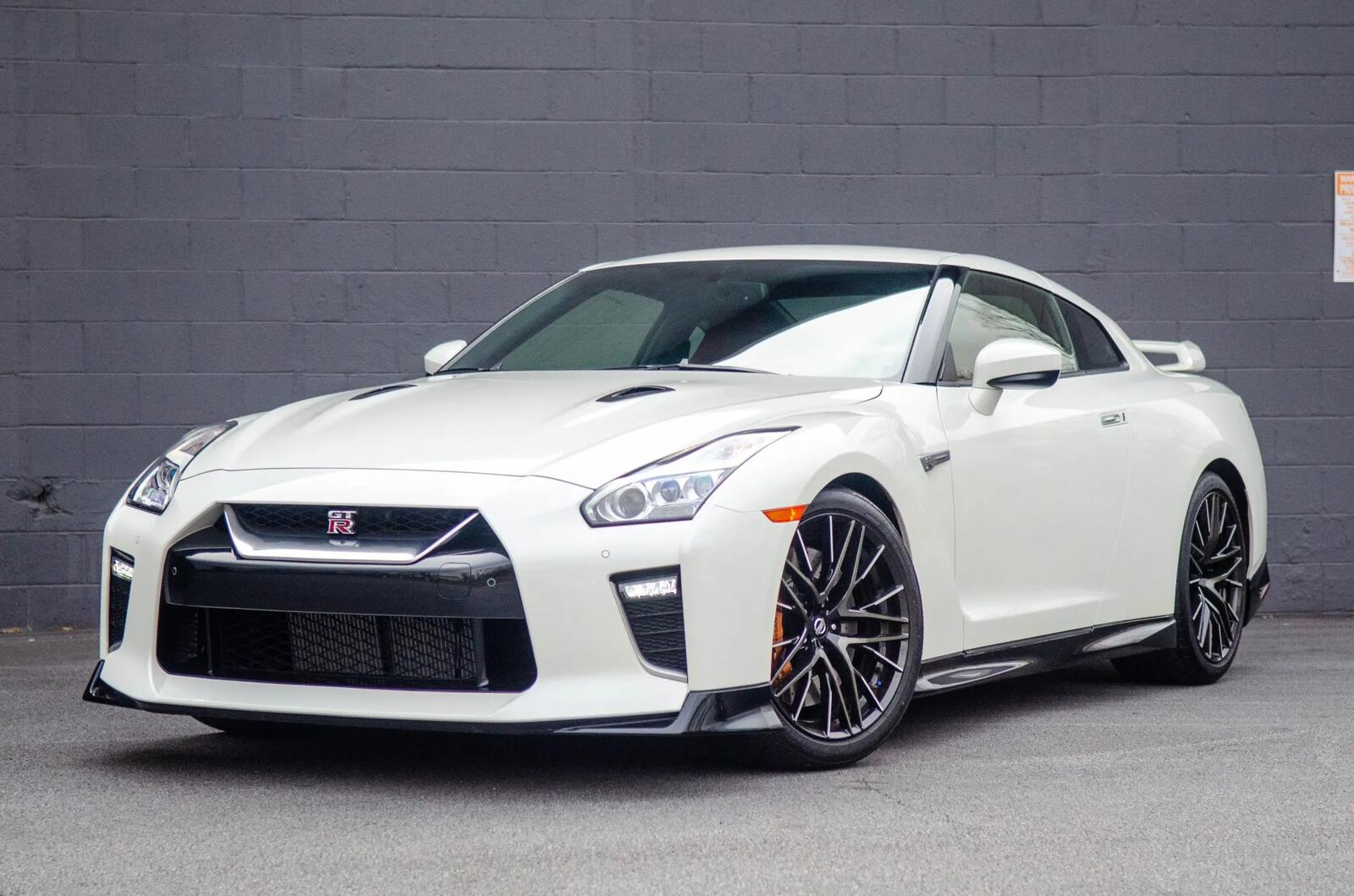 A white 2021 Nissan GT-R Premium parked in left front angle view